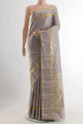 Grey Kanjivaram Silk Saree with Zari Butta on the body and Zari Border.  displayed on a mannequin
