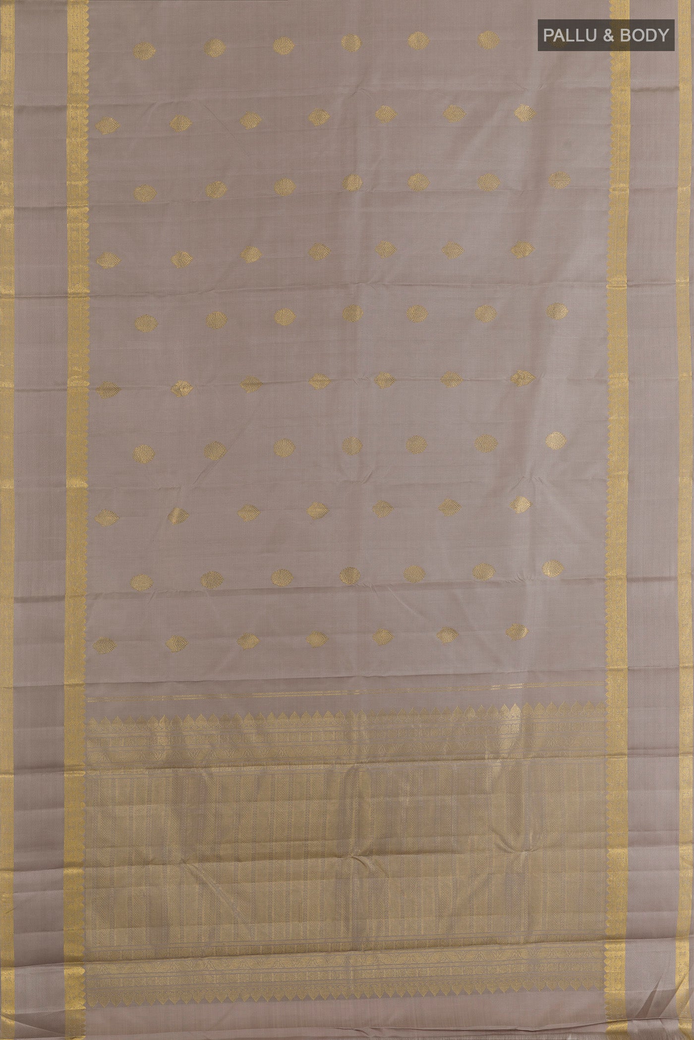 Flat view of Grey Kanjivaram Silk Saree with Zari Butta on the body and Zari Border. 