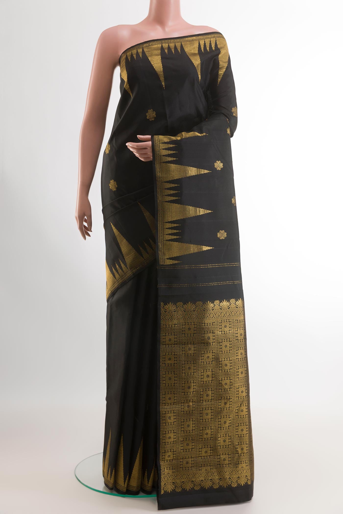 Black Kanjivaram Silk Saree with Zari Butta on the body and Zari Border.  displayed on a mannequin