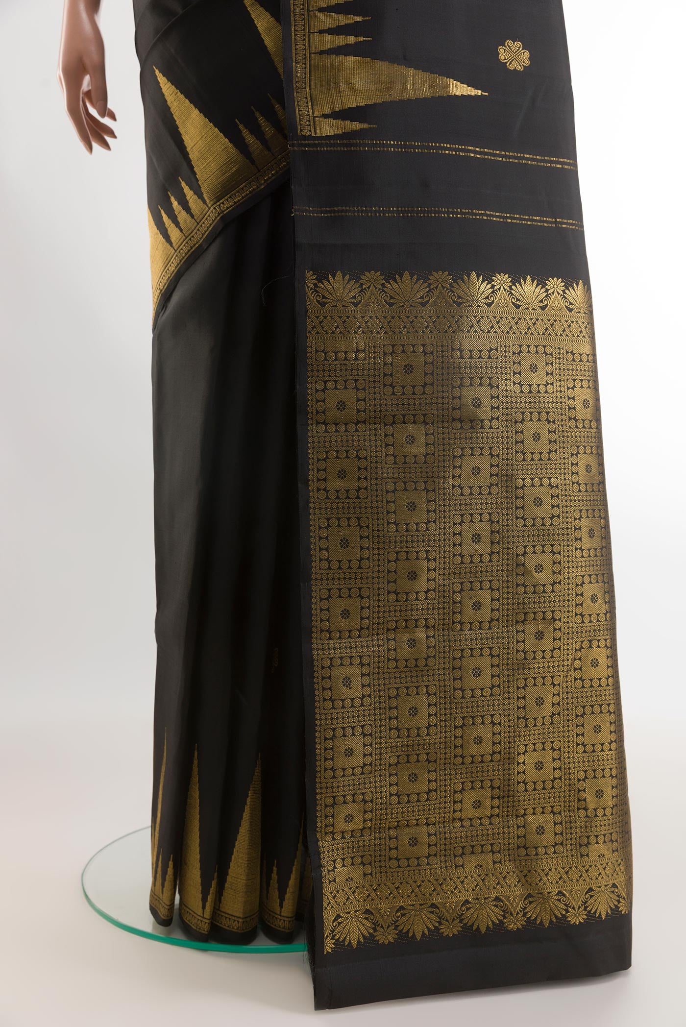 Pleats and pallu of Black Kanjivaram Silk Saree with Zari Butta on the body and Zari Border. 