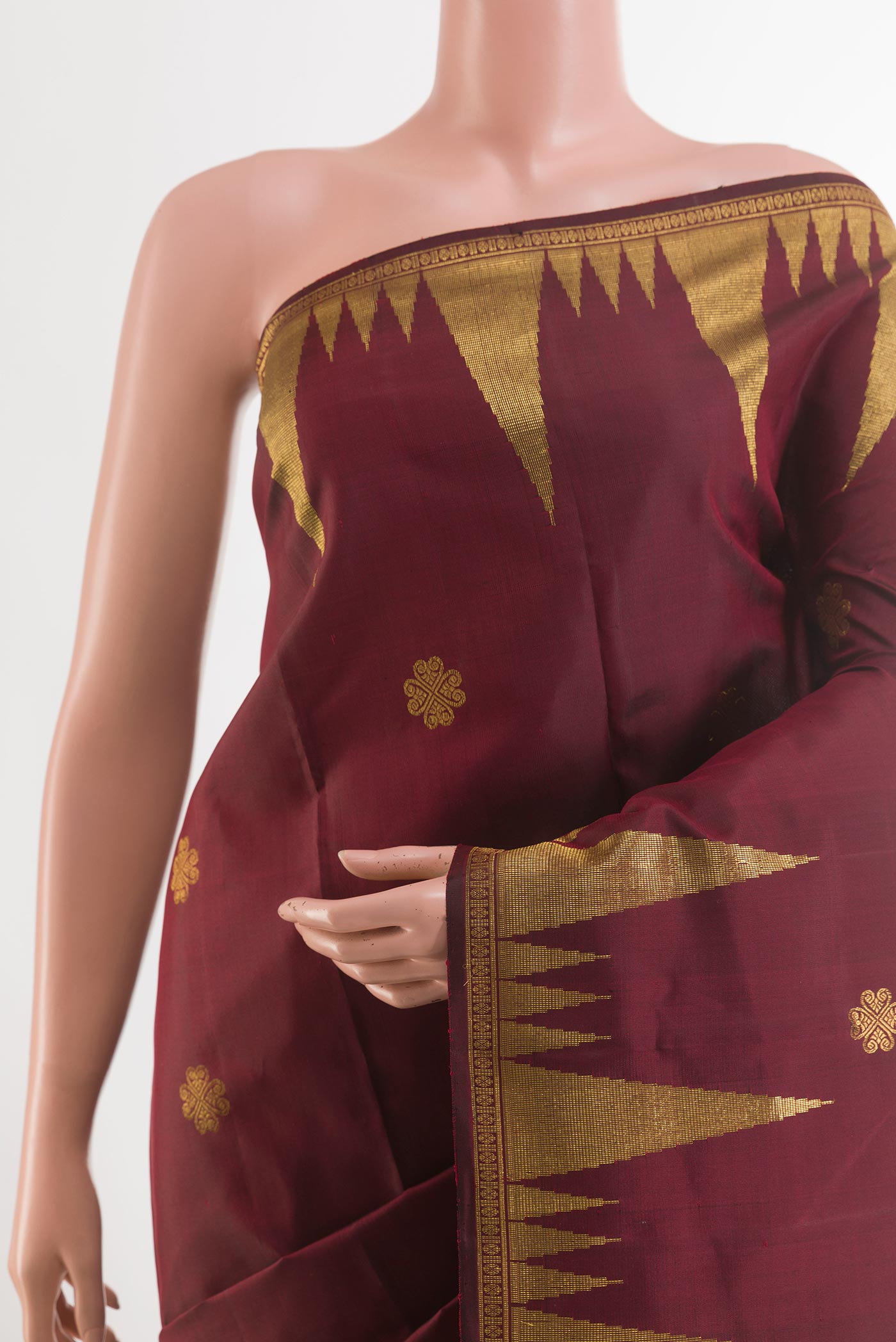 Border image of Maroon Kanjivaram Silk Saree with Zari Butta on the body and Zari Border. 