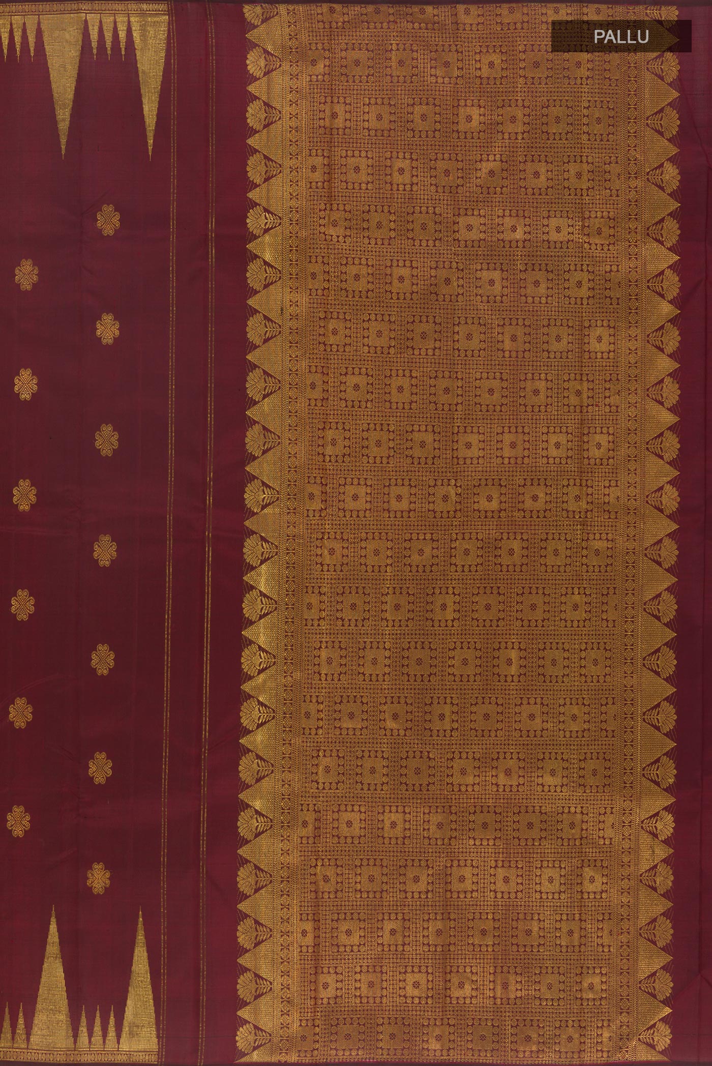Close up image of the pallu of Maroon Kanjivaram Silk Saree with Zari Butta on the body and Zari Border. 