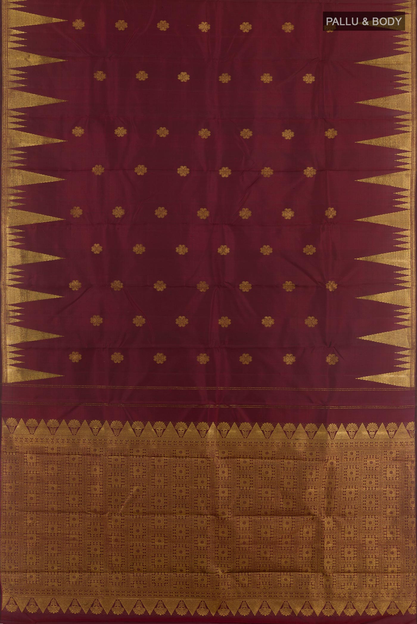 Flat view of Maroon Kanjivaram Silk Saree with Zari Butta on the body and Zari Border. 