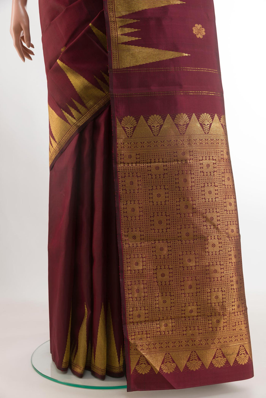 Pleats and pallu of Maroon Kanjivaram Silk Saree with Zari Butta on the body and Zari Border. 