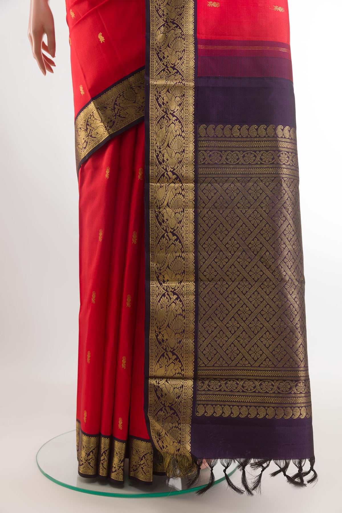 Pleats and pallu of Red Kanjivaram Silk Saree with Zari Butta on the body and Zari Border. 