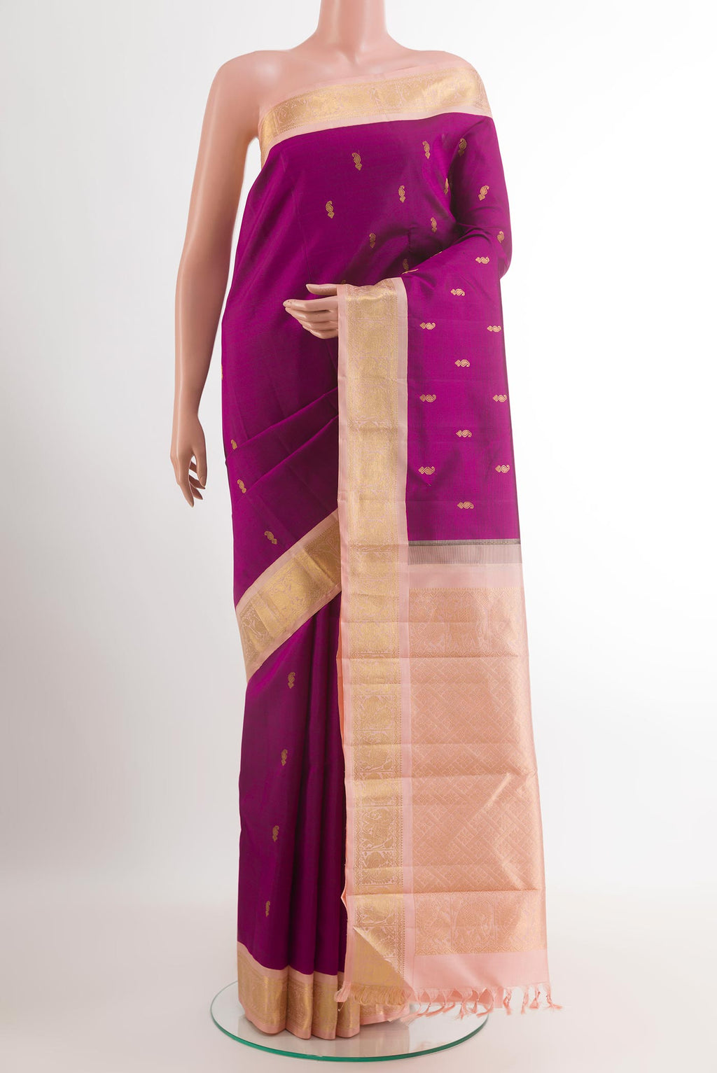 Purple Kanjivaram Silk Saree with Zari Butta on the body and Zari Border.  displayed on a mannequin