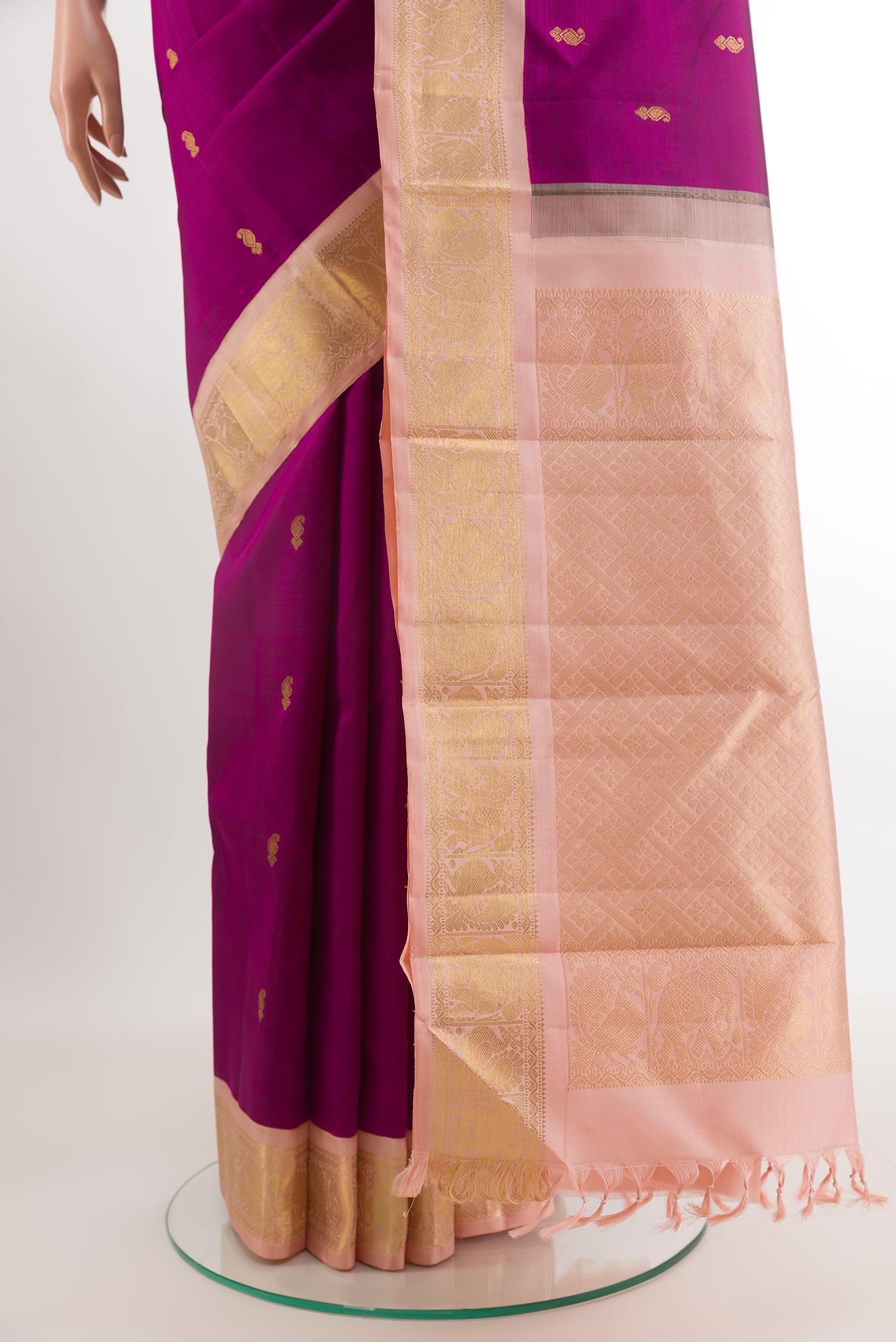 Pleats and pallu of Purple Kanjivaram Silk Saree with Zari Butta on the body and Zari Border. 