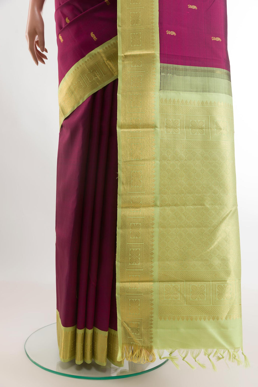 Pleats and pallu of Purple Kanjivaram Silk Saree with Zari Butta on the body and Zari Border. 