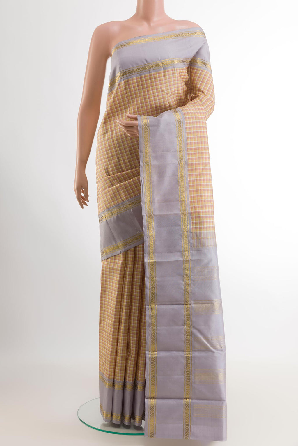 Yellow Kanjivaram Silk Saree with Checked design on the body and Zari Border.  displayed on a mannequin