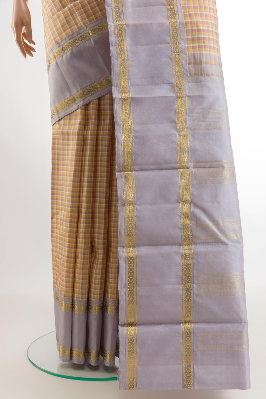 Pleats and pallu of Yellow Kanjivaram Silk Saree with Checked design on the body and Zari Border. 