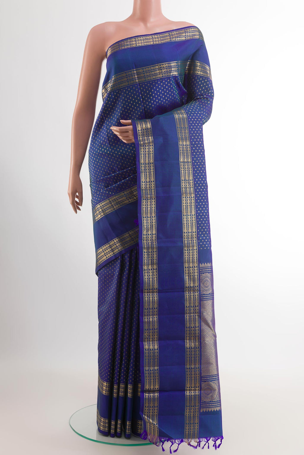 Blue Kanjivaram Silk Saree with Zari Butta on the body and Zari Border.  displayed on a mannequin