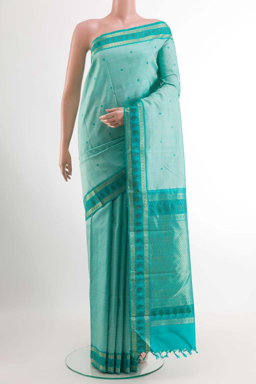 Sky Blue Kanjivaram Silk Saree with Thread Butta on the body and Zari Border.  displayed on a mannequin