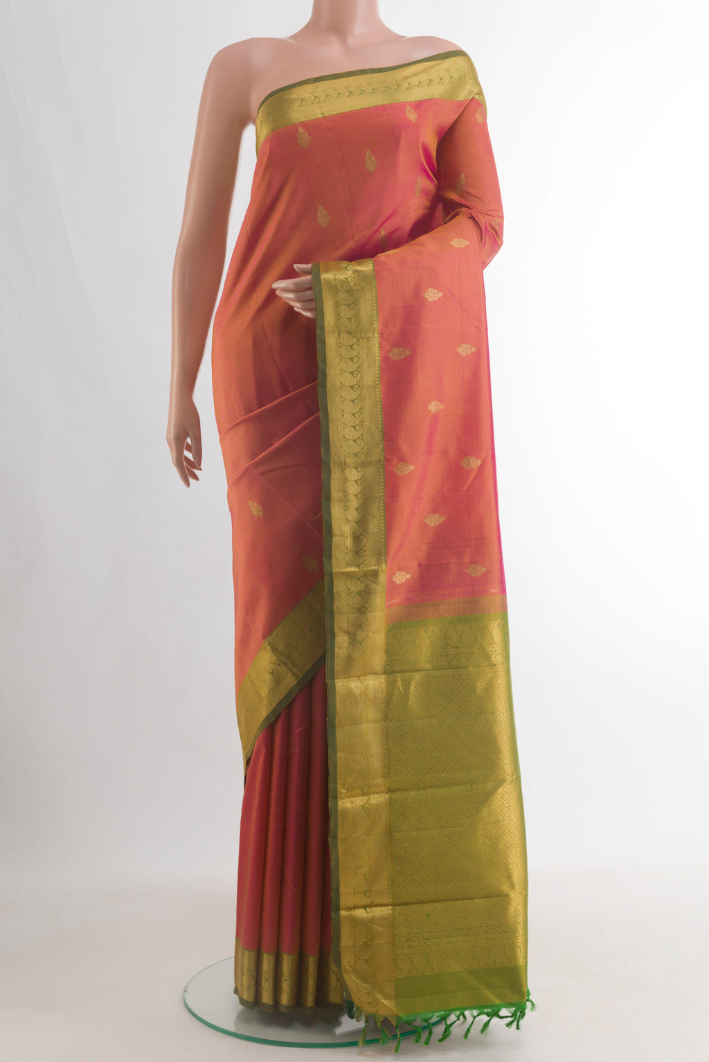 Pure Silk Pinkish Yellow Dual Tone Kanjivaram Saree with Zari Butta on the body and Zari Border.  displayed on a mannequin