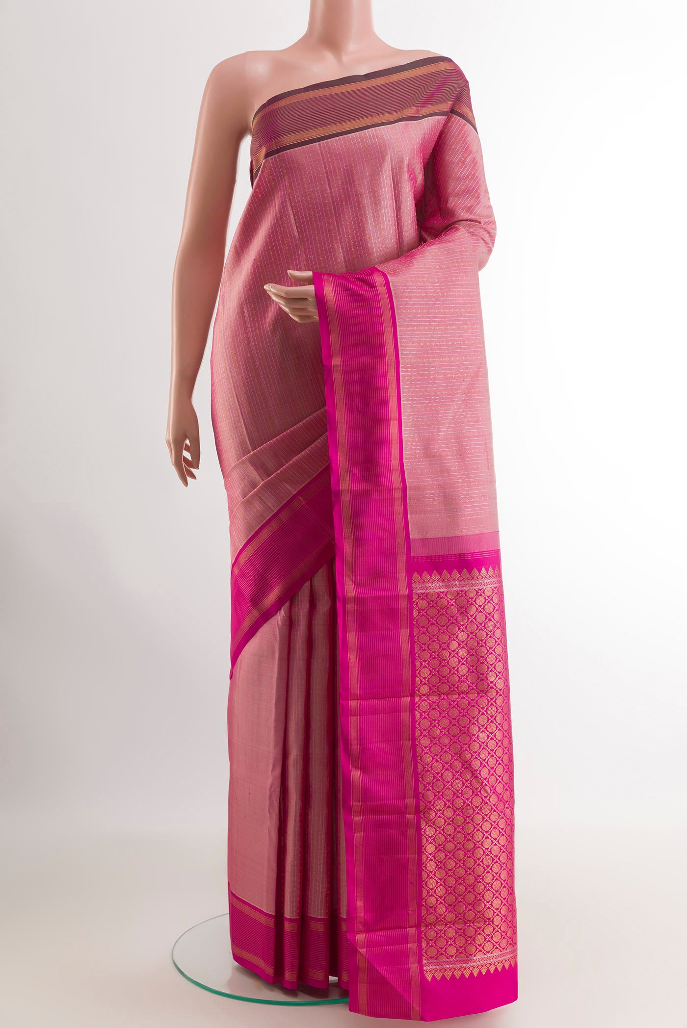 Rose pink Kanjivaram Silk Saree with Stripes on the body and Zari Border.  displayed on a mannequin