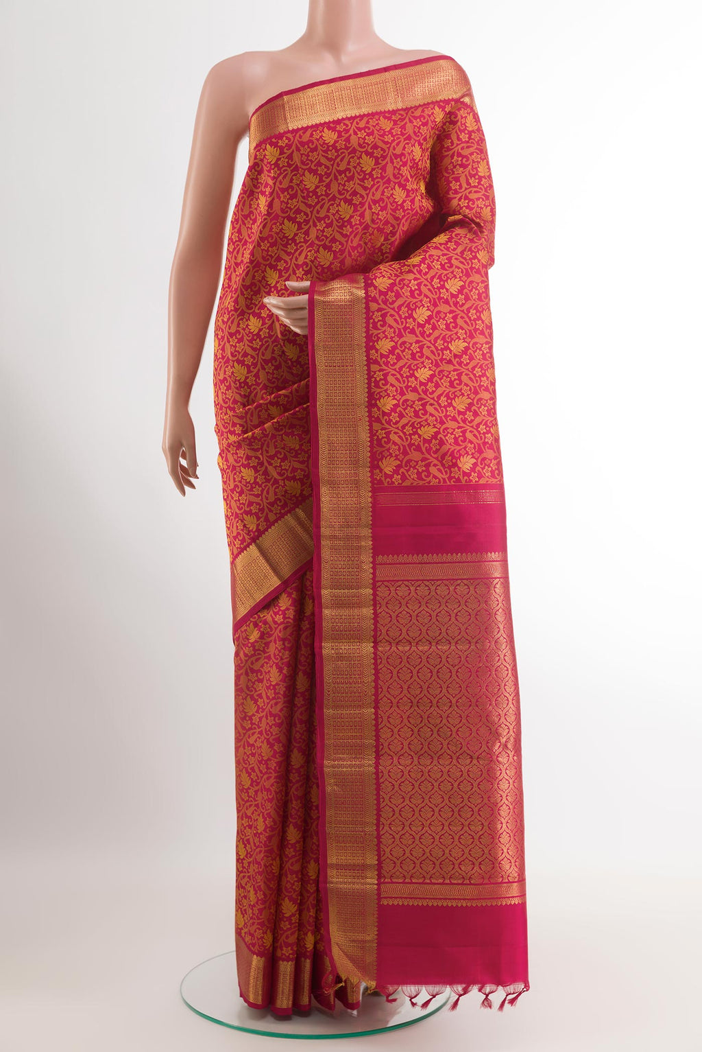 Red Kanjivaram Silk Saree with Jacquard design on the body and Zari Border.  displayed on a mannequin