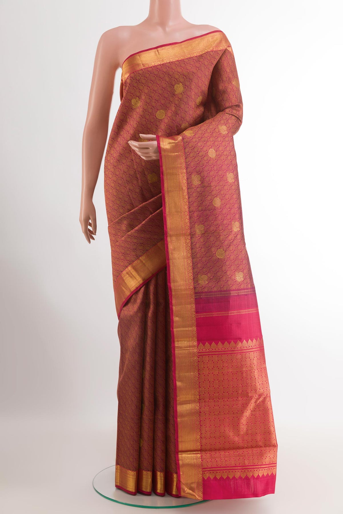 Magenta Kanjivaram Silk Saree with Jacquard With Zari Butta on the body and Zari Border.  displayed on a mannequin