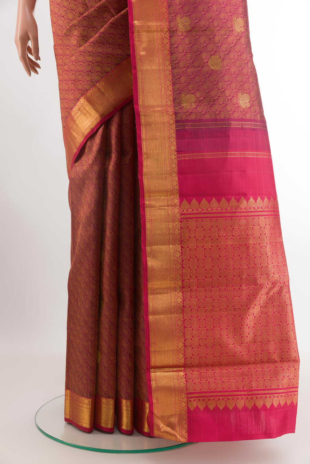 Pleats and pallu of Magenta Kanjivaram Silk Saree with Jacquard With Zari Butta on the body and Zari Border. 