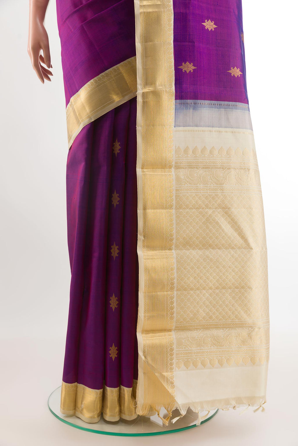 Pleats and pallu of Purple Kanjivaram Silk Saree with Zari Butta on the body and Zari Border. 