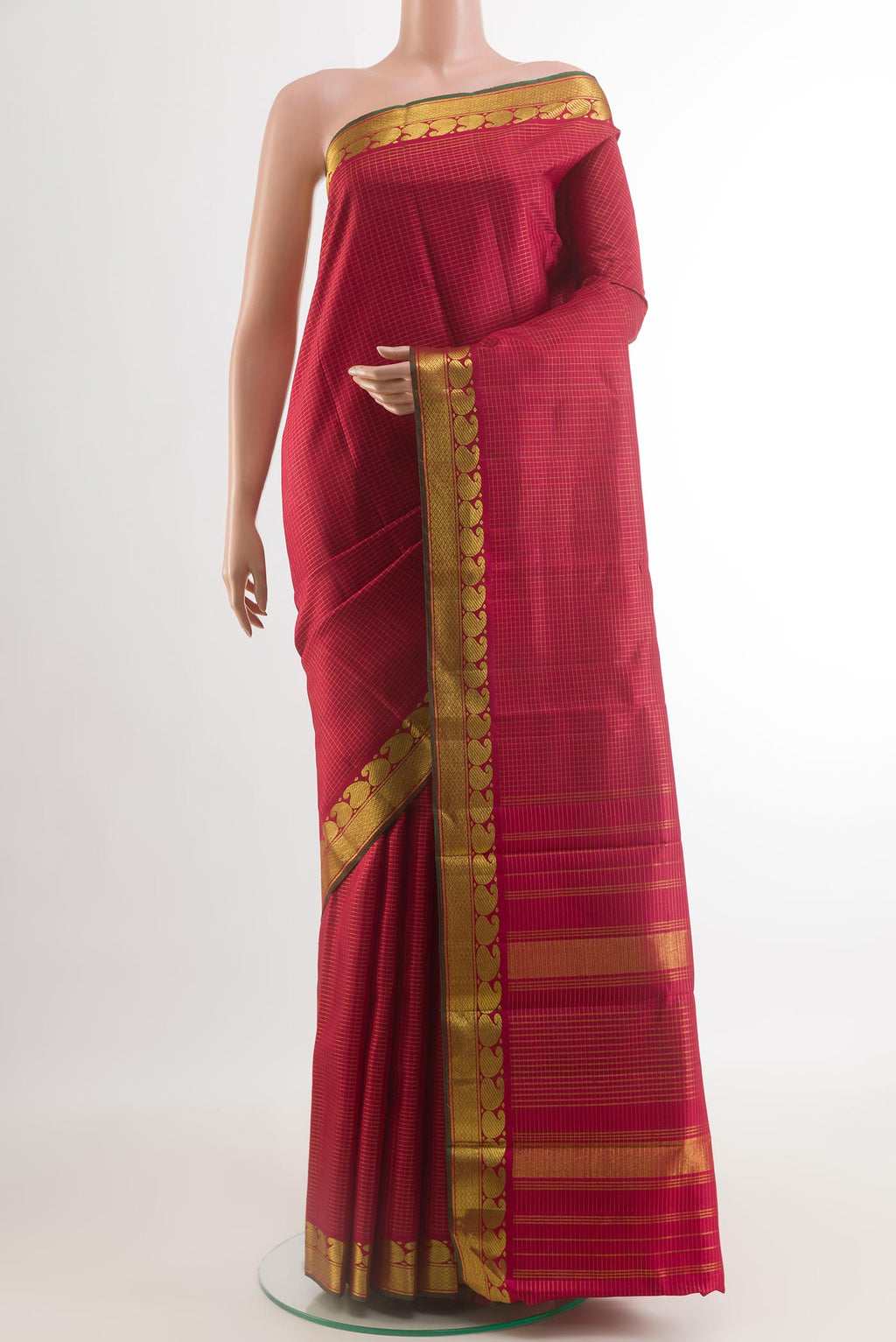 Maroon Kanchipuram Silk Saree with Checked design on the body and Zari Border.  displayed on a mannequin