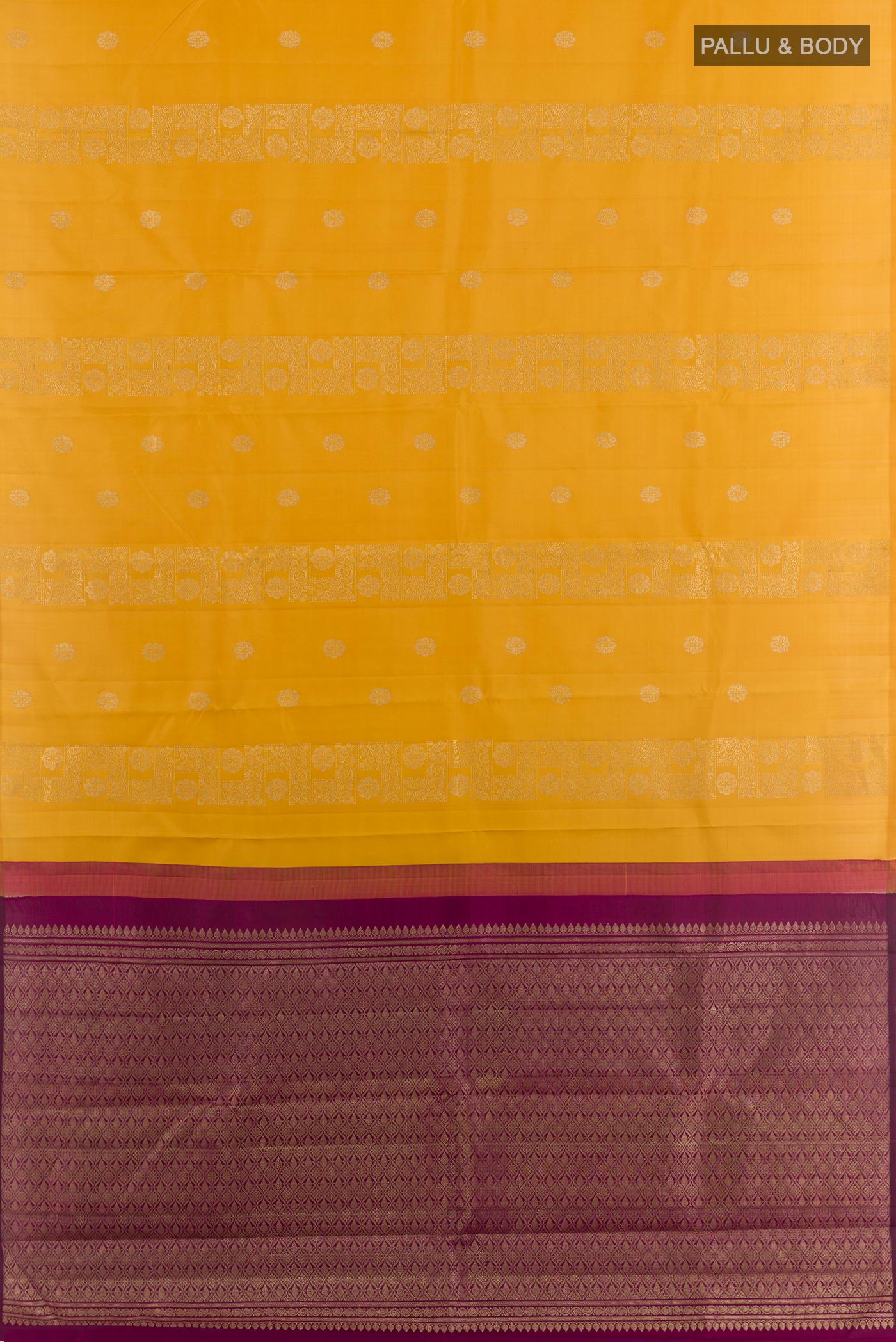 Flat view of Yellow Kanchipuram Silk Saree with Zari Butta on the body and Zari Border. 