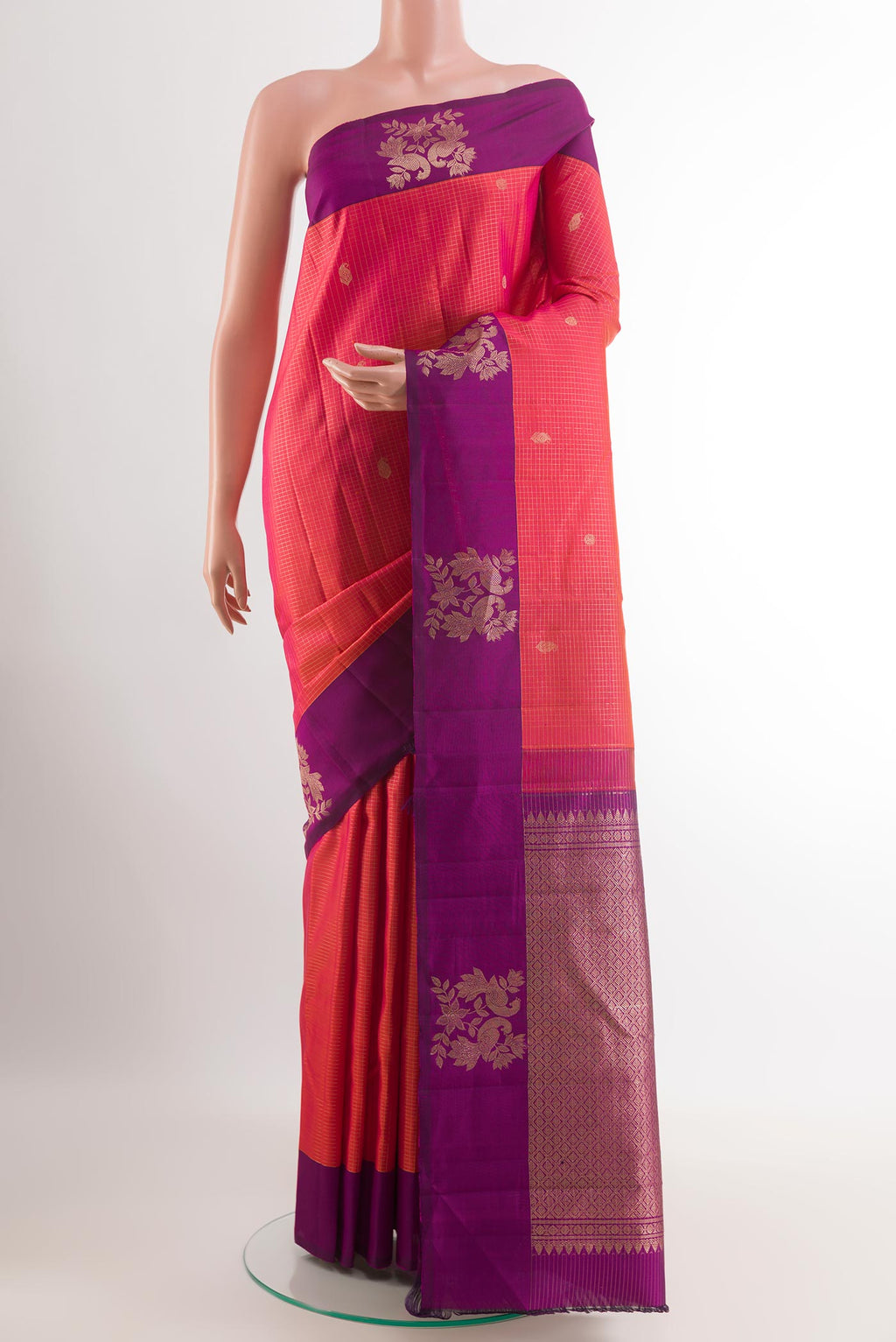 Pink Kanjivaram Silk Saree with Checked design on the body and Zari Border.  displayed on a mannequin