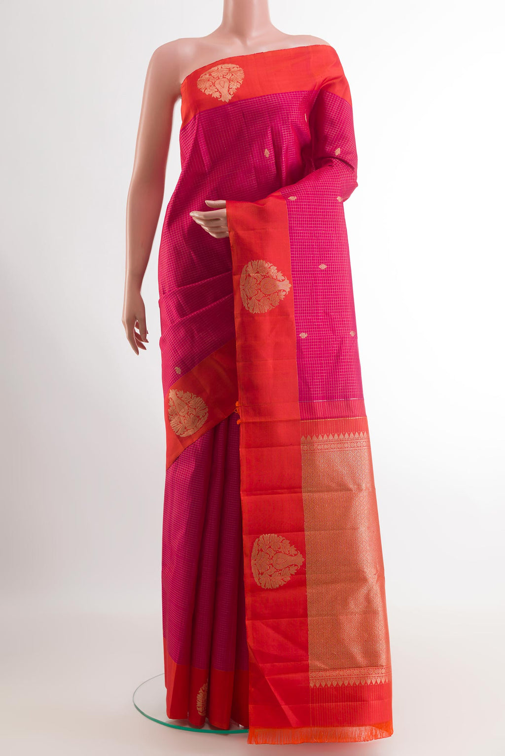 Pink Kanjivaram Silk Saree with Checked design on the body and Zari Border.  displayed on a mannequin