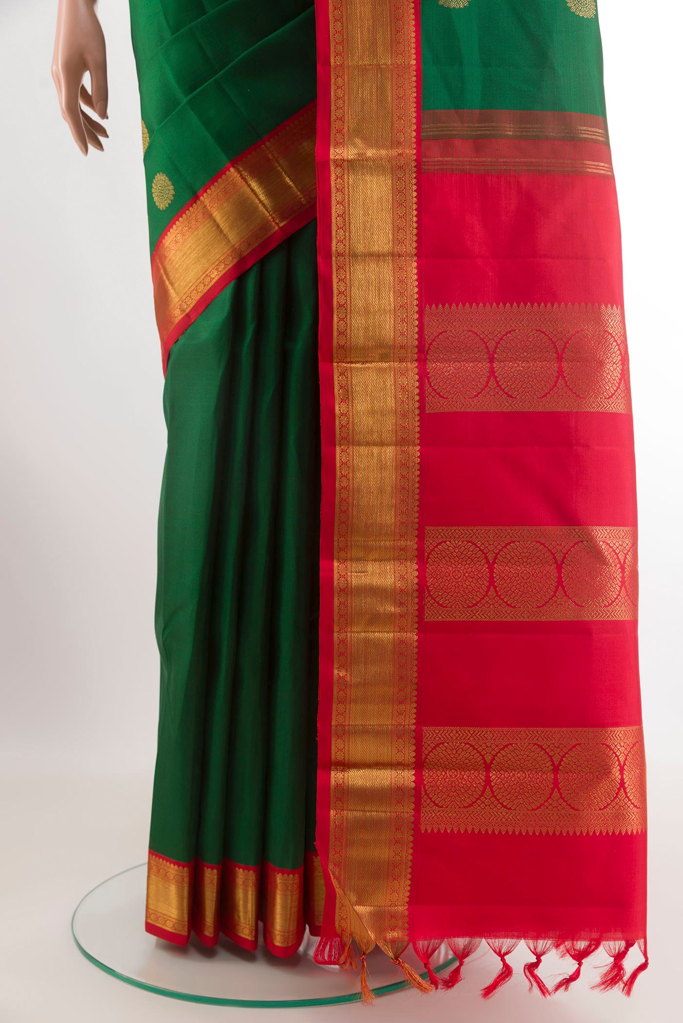 Pleats and pallu of Green Kanchipuram Silk Saree with Zari Butta on the body and Zari Border. 