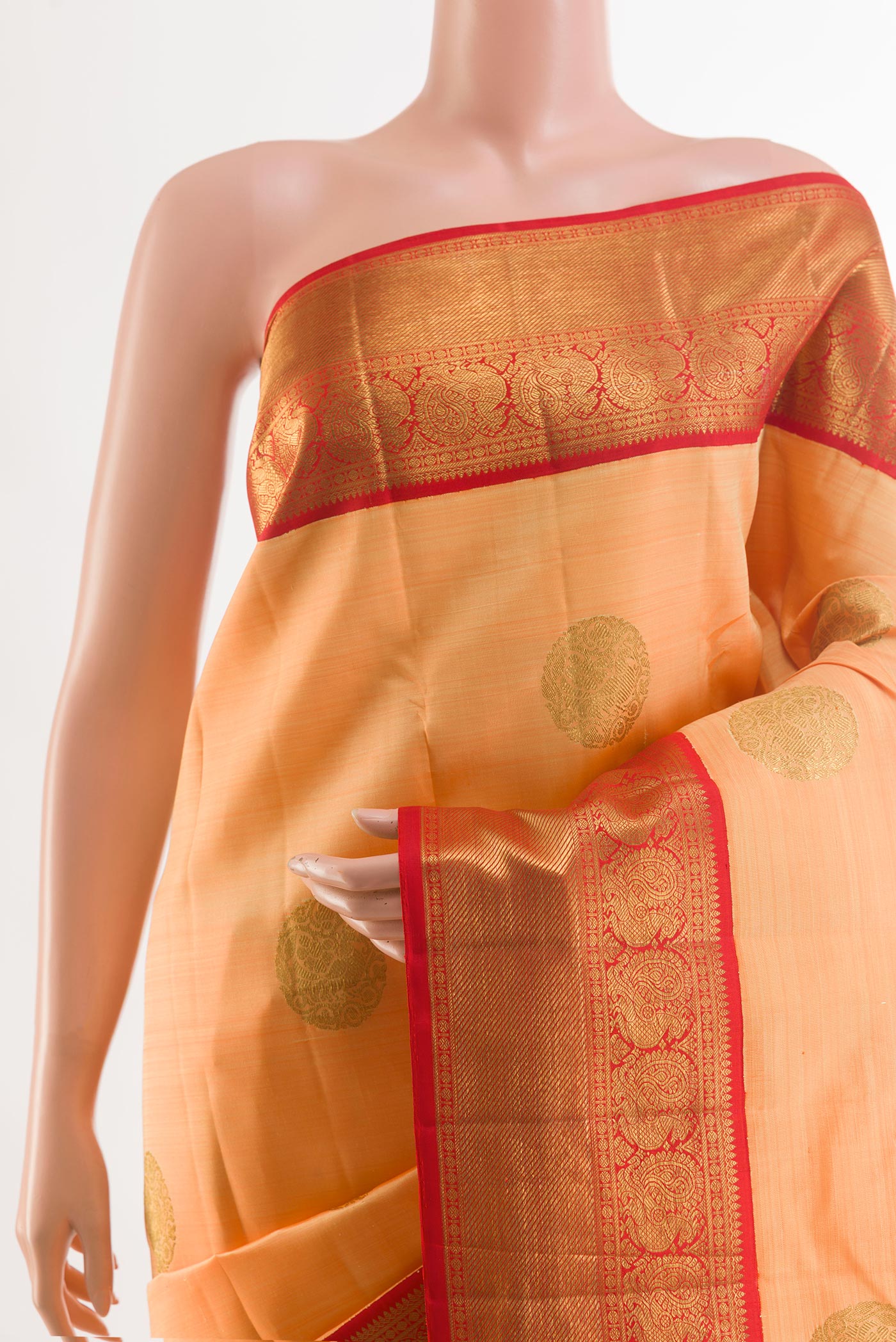 Border image of Orange Kanchipuram Silk Saree with Zari Butta on the body and Zari Border. 