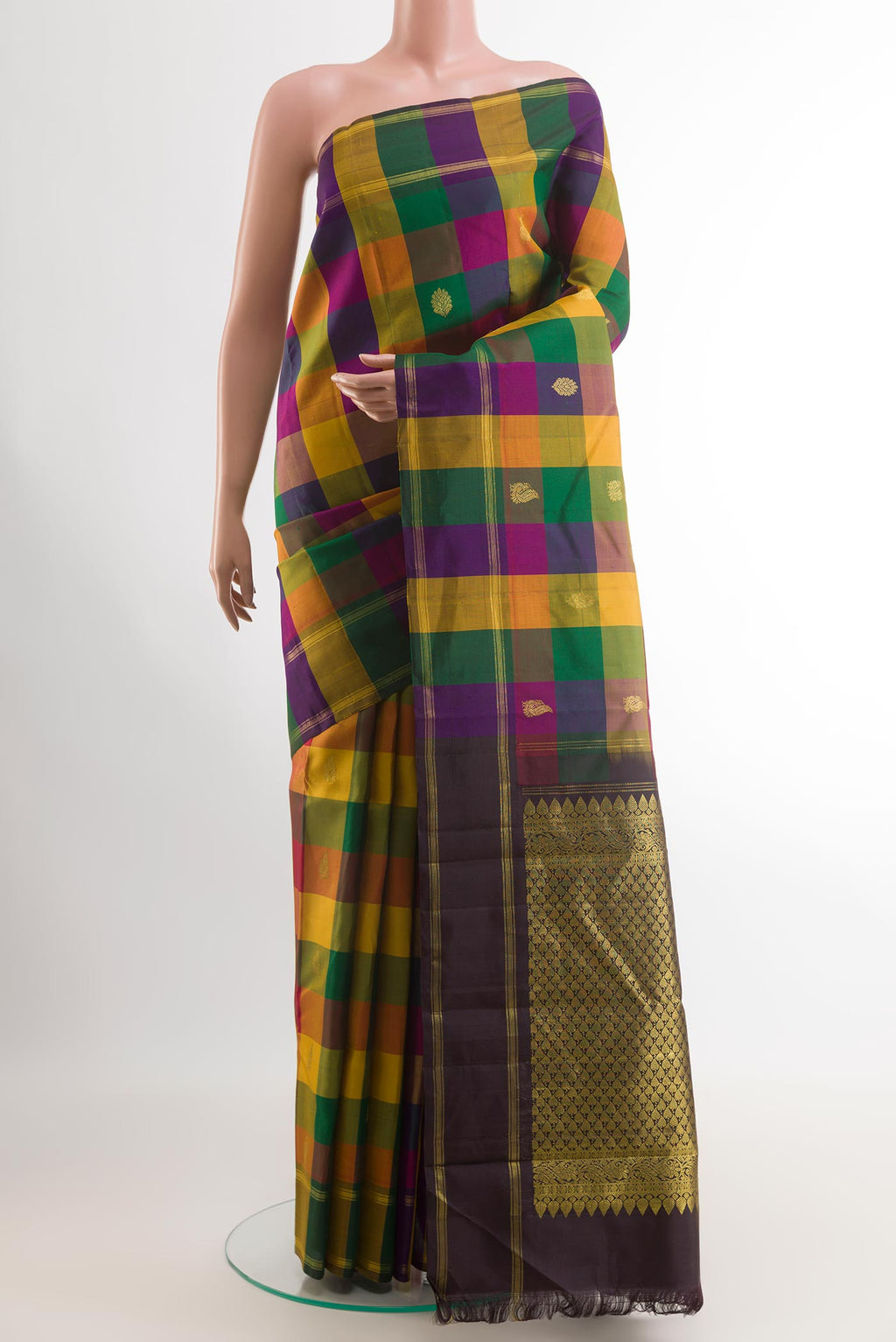 Multi Color Kanchipuram Silk Saree with Zari Butta on the body and Zari Border.  displayed on a mannequin