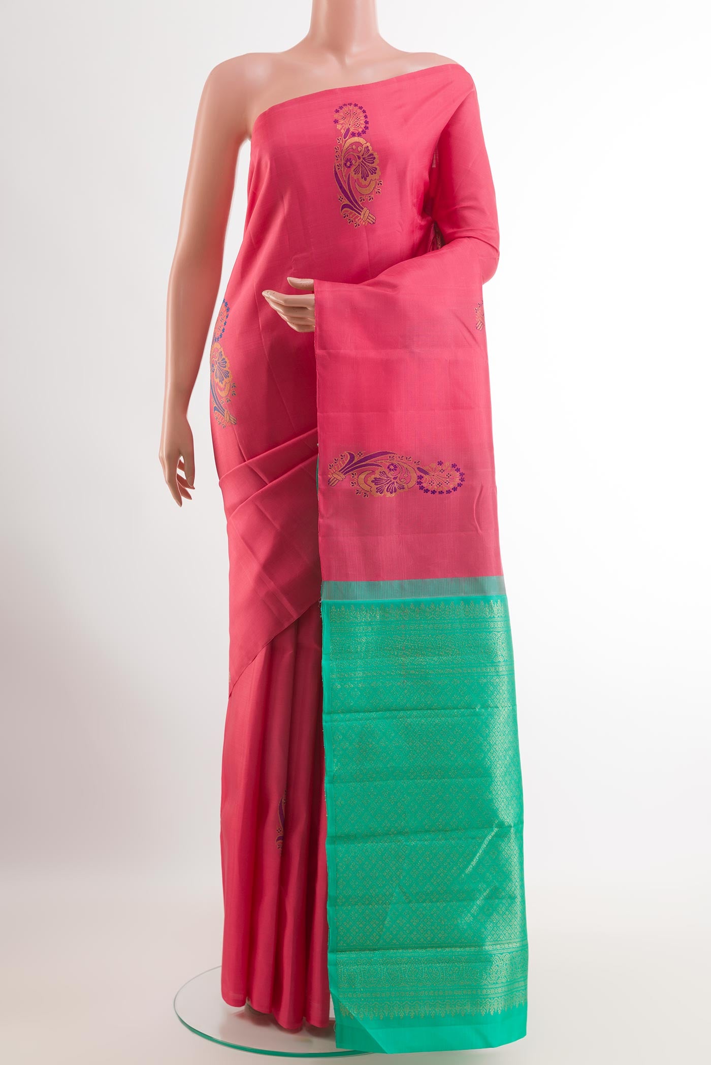 Pink Kanjivaram Silk Saree with Zari Butta on the body and Zari Border.  displayed on a mannequin