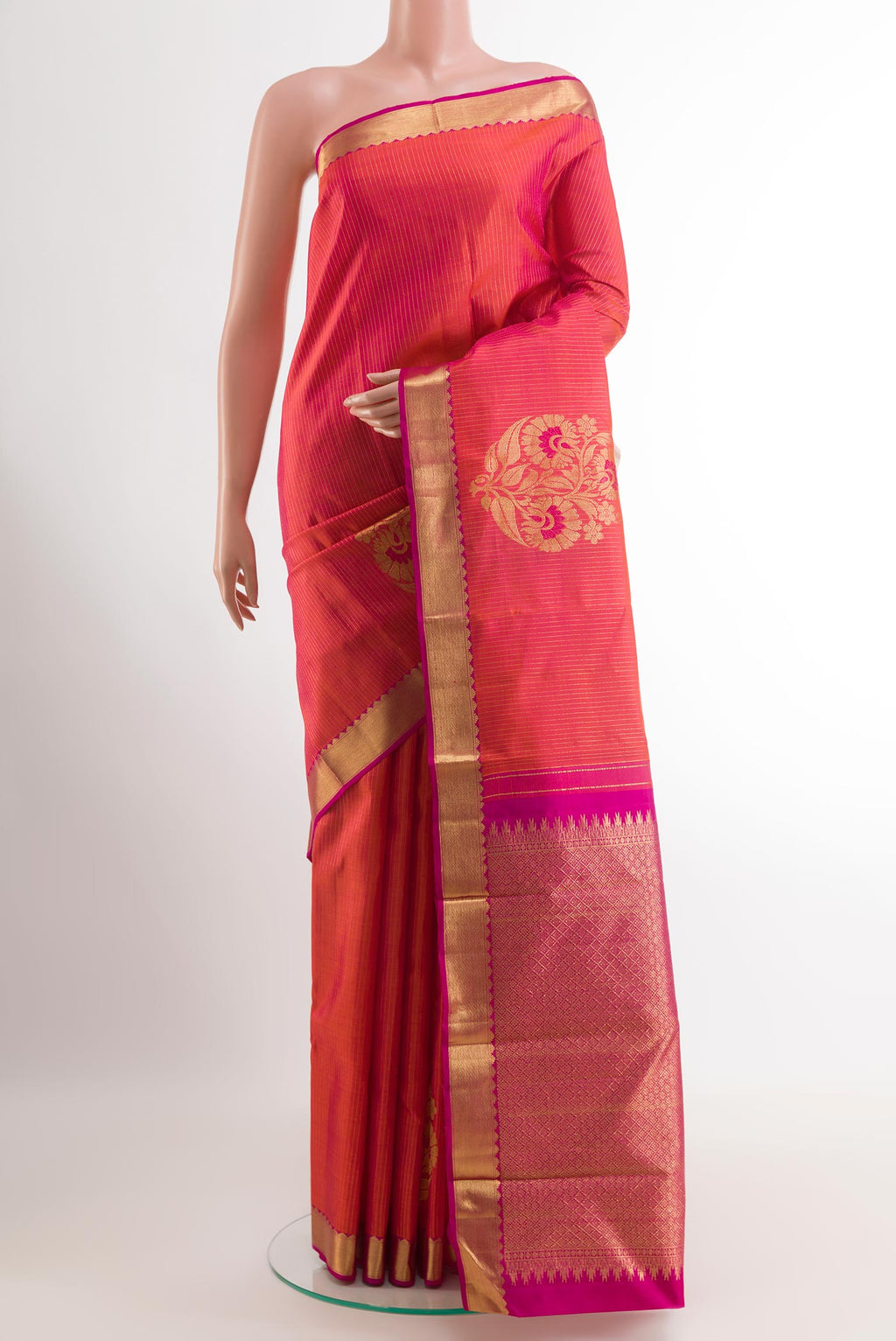 Pink Kanchipuram Silk Saree with Zari Butta on the body and Zari Border.  displayed on a mannequin