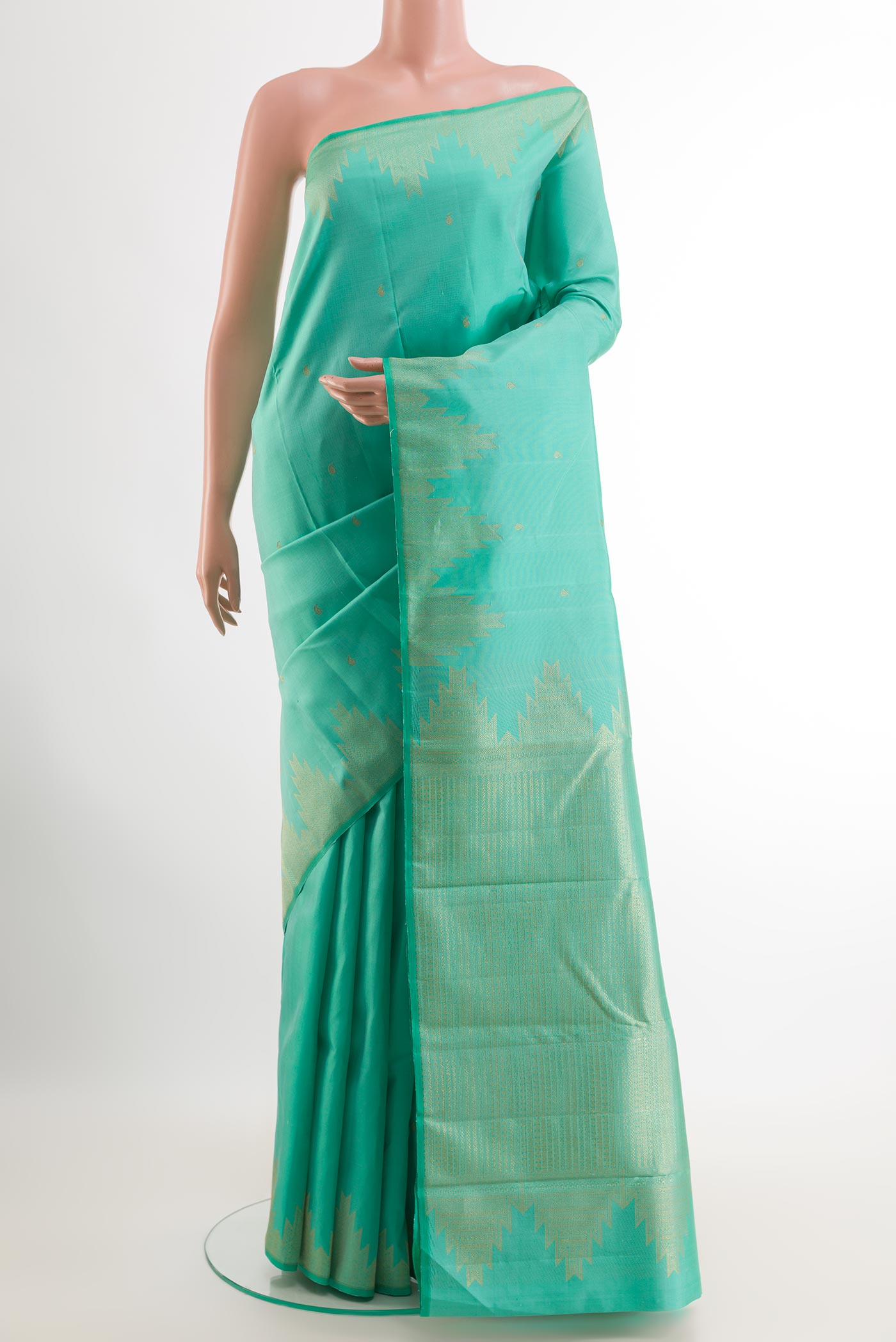 Sea Green Kanjivaram Silk Saree with Zari Butta on the body and Zari Border.  displayed on a mannequin
