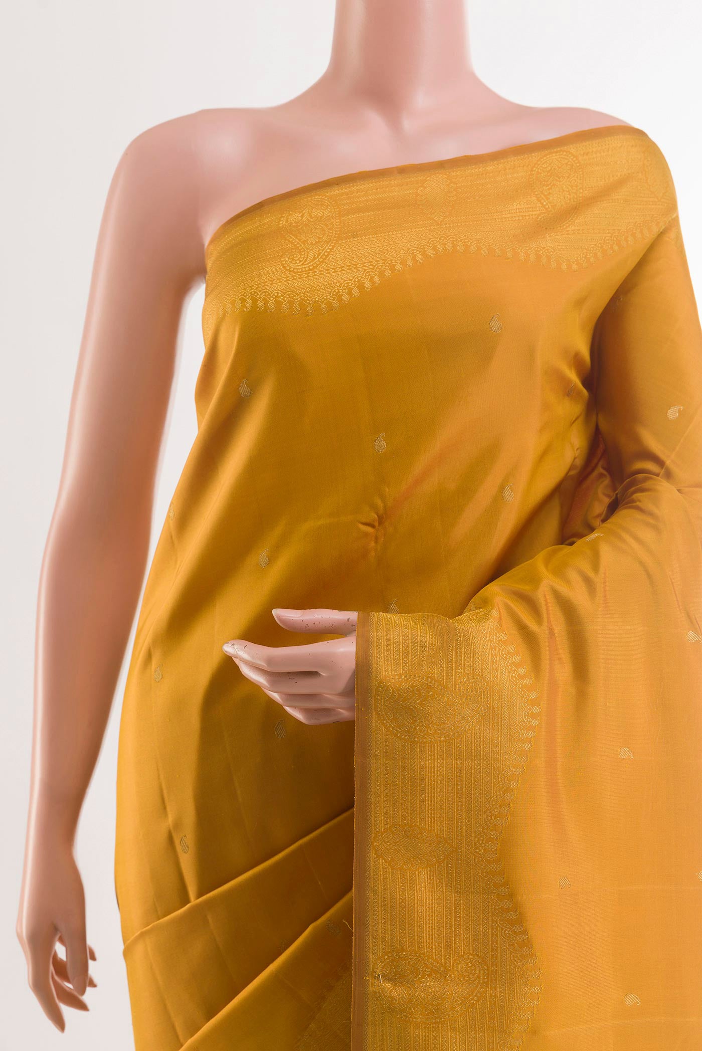 Border image of Mustard Kanjivaram Silk Saree with Zari Butta on the body and Zari Border. 