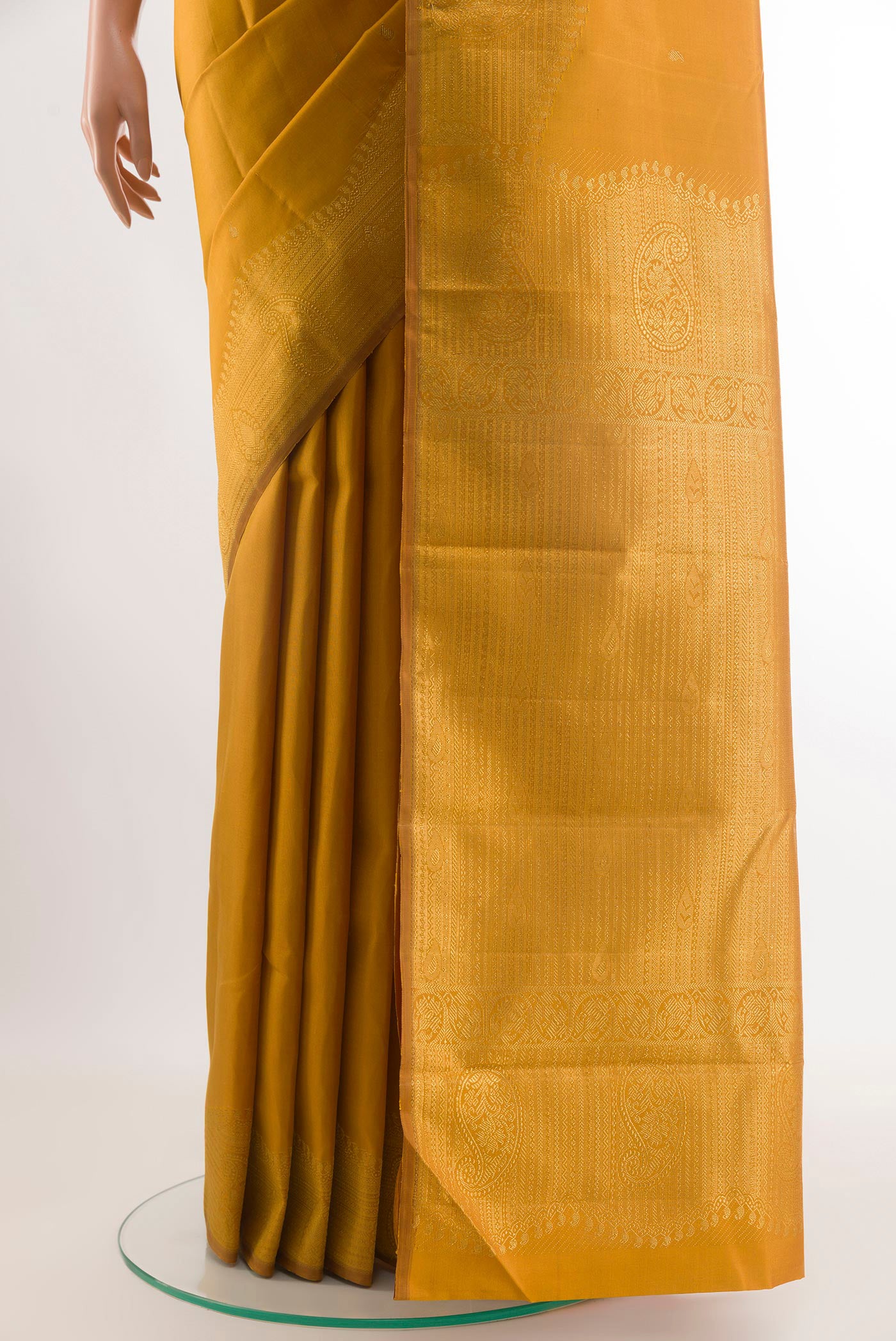 Pleats and pallu of Mustard Kanjivaram Silk Saree with Zari Butta on the body and Zari Border. 