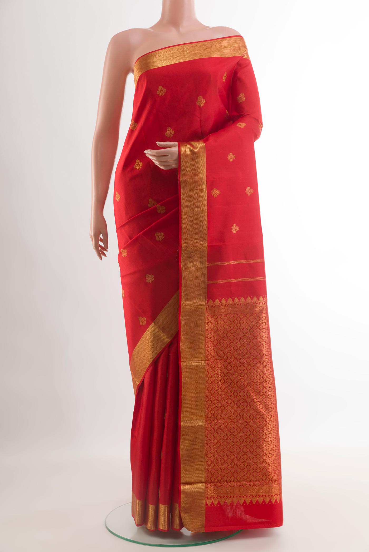 Red Kanjivaram Silk Saree with Zari Butta on the body and Zari Border.  displayed on a mannequin
