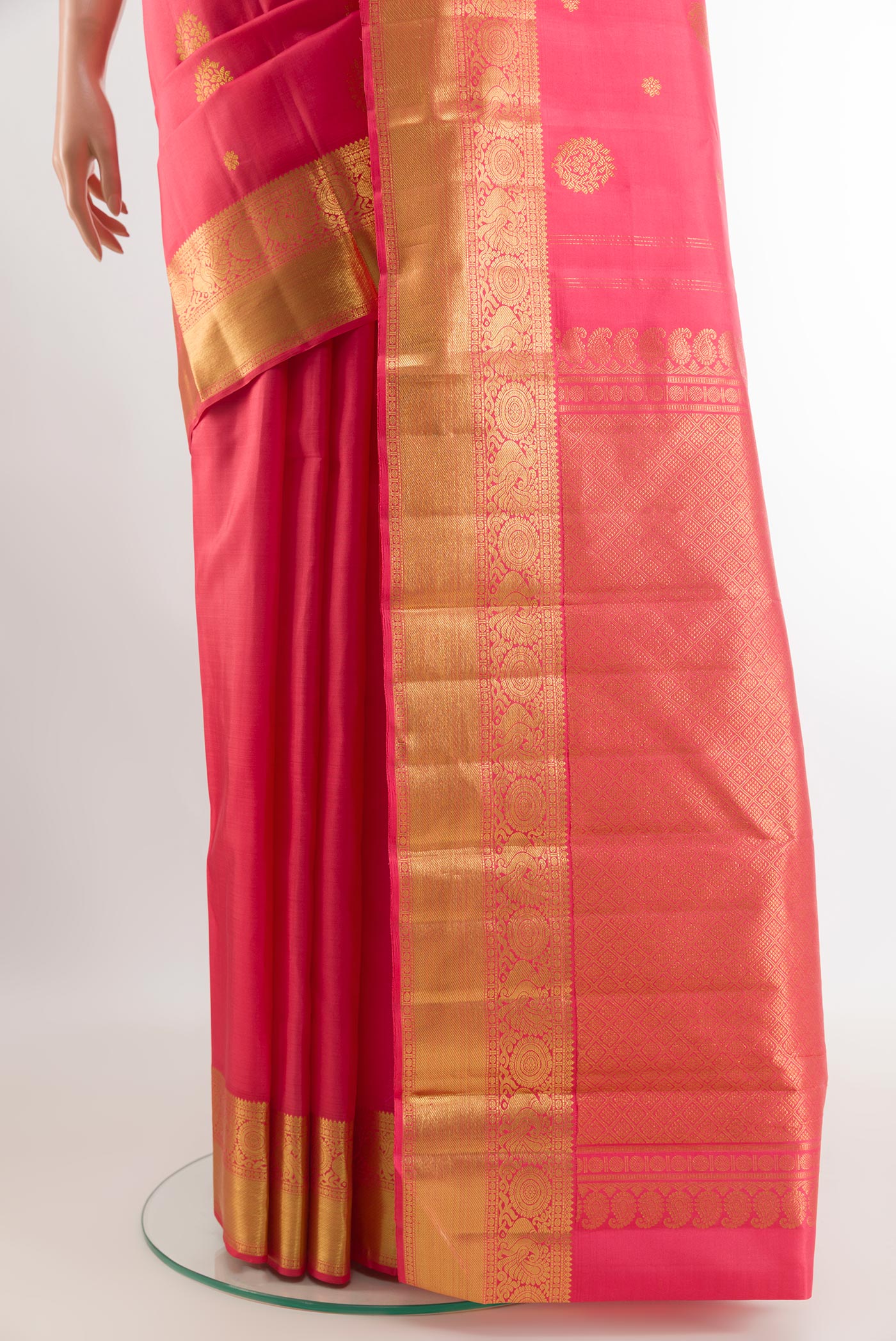 Pleats and pallu of Pink Kanjivaram Silk Saree with Zari Butta on the body and Zari Border. 