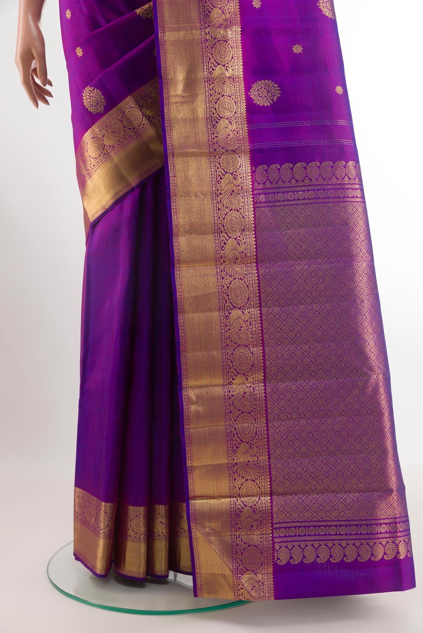 Pleats and pallu of Purple Kanjivaram Silk Saree with Zari Butta on the body and Zari Border. 
