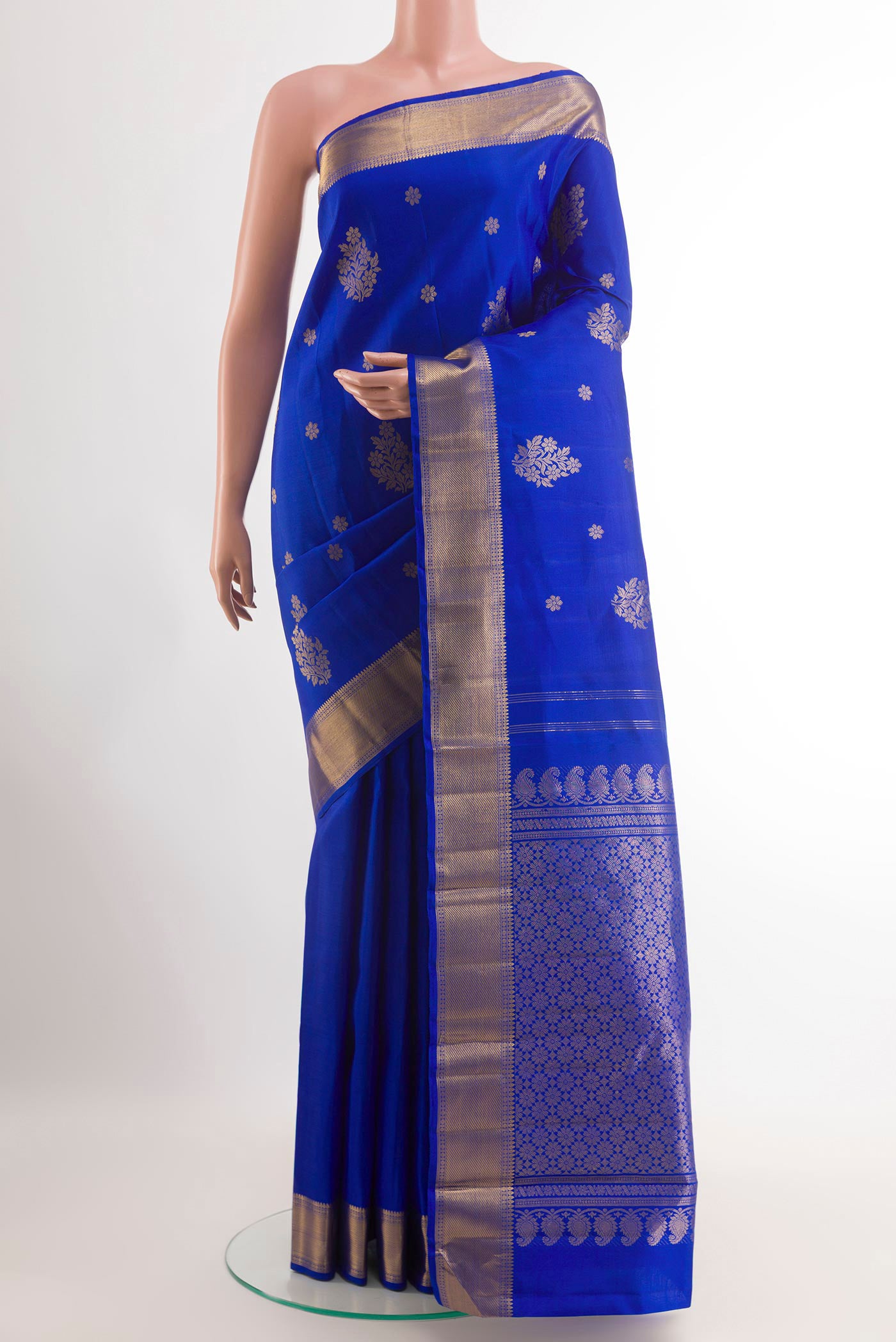Blue Kanjivaram Silk Saree with Zari Butta on the body and Zari Border.  displayed on a mannequin