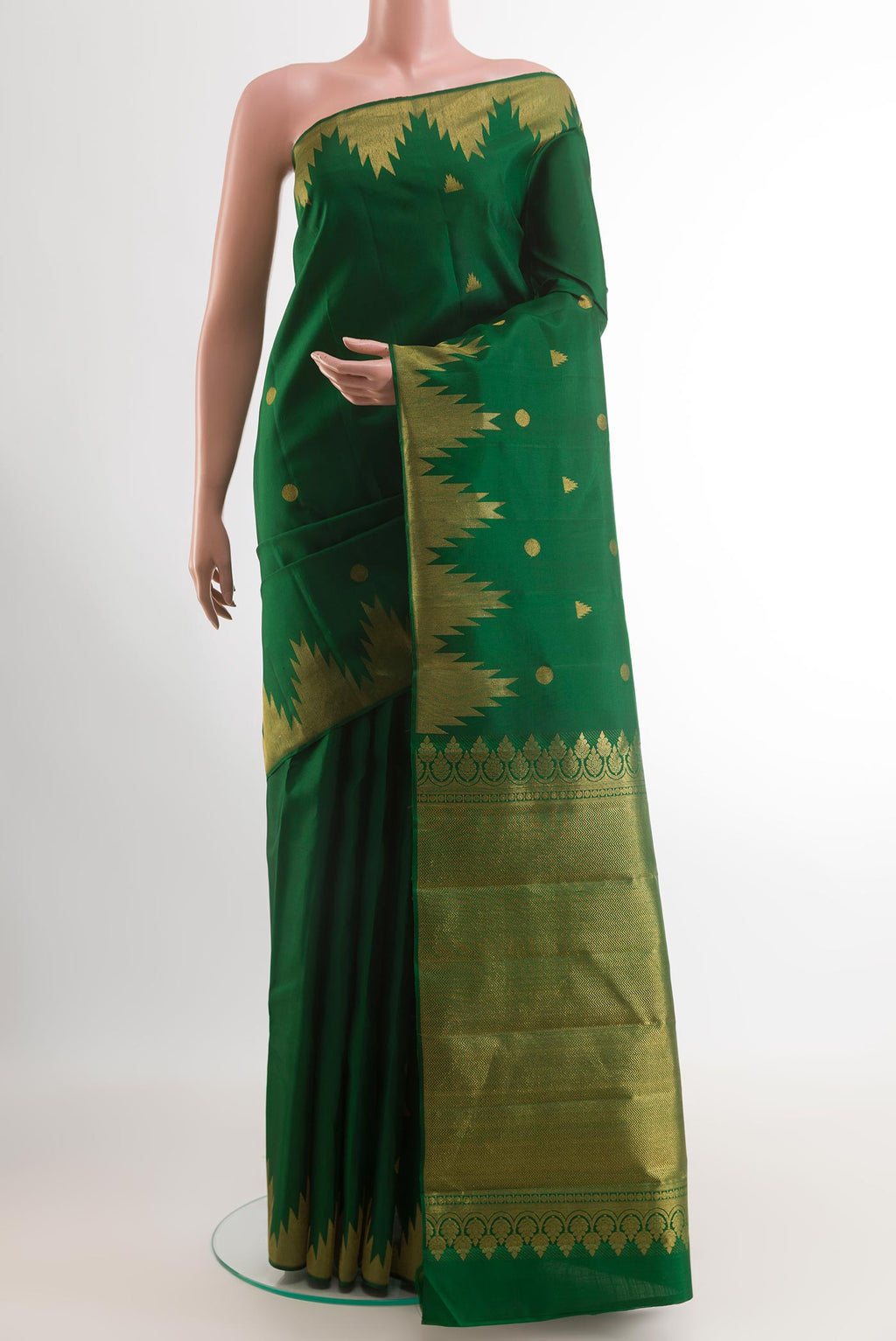 Green Kanjivaram Silk Saree with Zari Butta on the body and Zari Border.  displayed on a mannequin