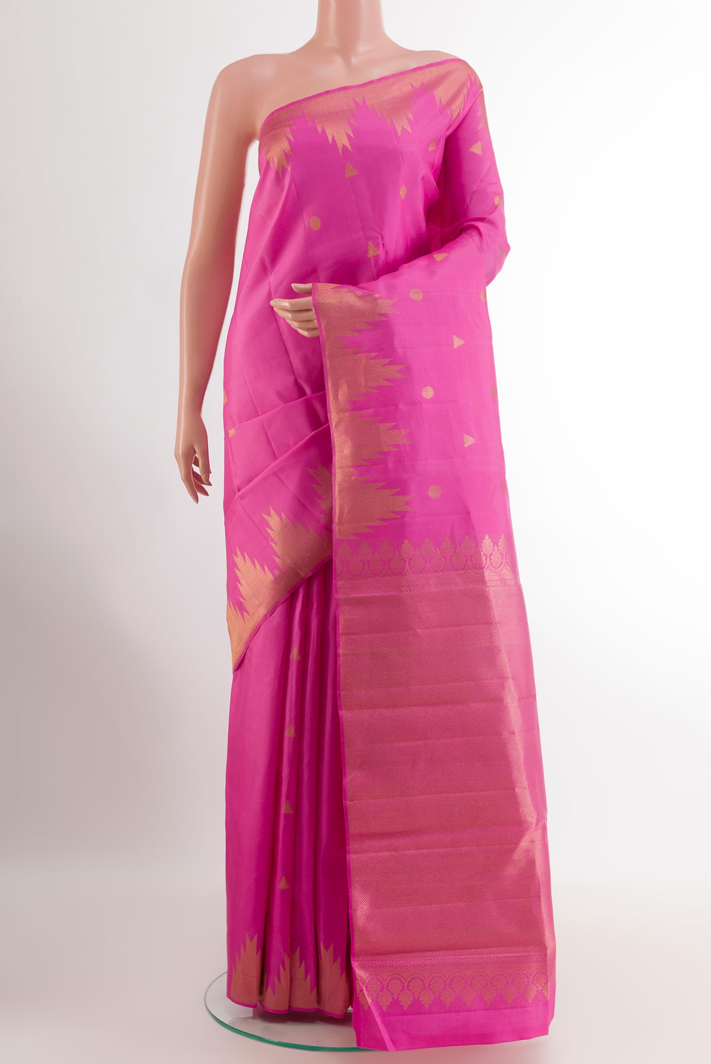 Pink Kanjivaram Silk Saree with Zari Butta on the body and Zari Border.  displayed on a mannequin