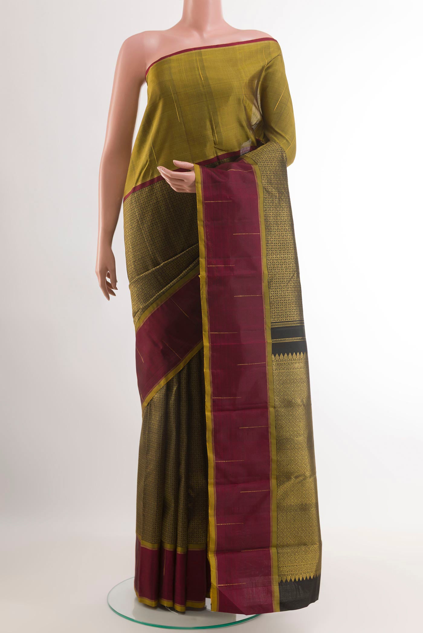 Black Kanjivaram Silk Saree with Zari Brocade on the body and Ganga Jamuna Border.  displayed on a mannequin