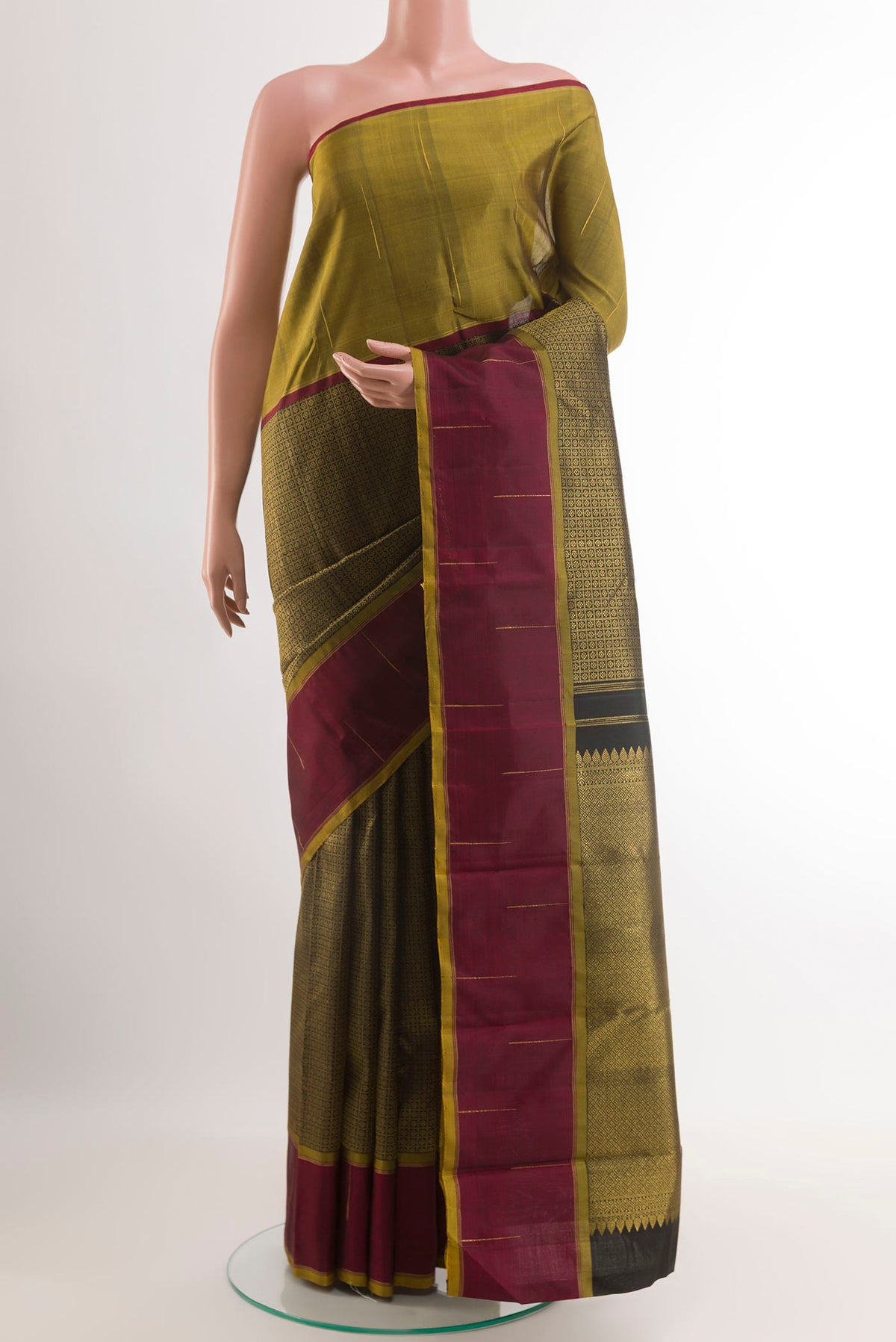 Black Kanjivaram Silk Saree with Zari Brocade on the body and Ganga Jamuna Border.  displayed on a mannequin