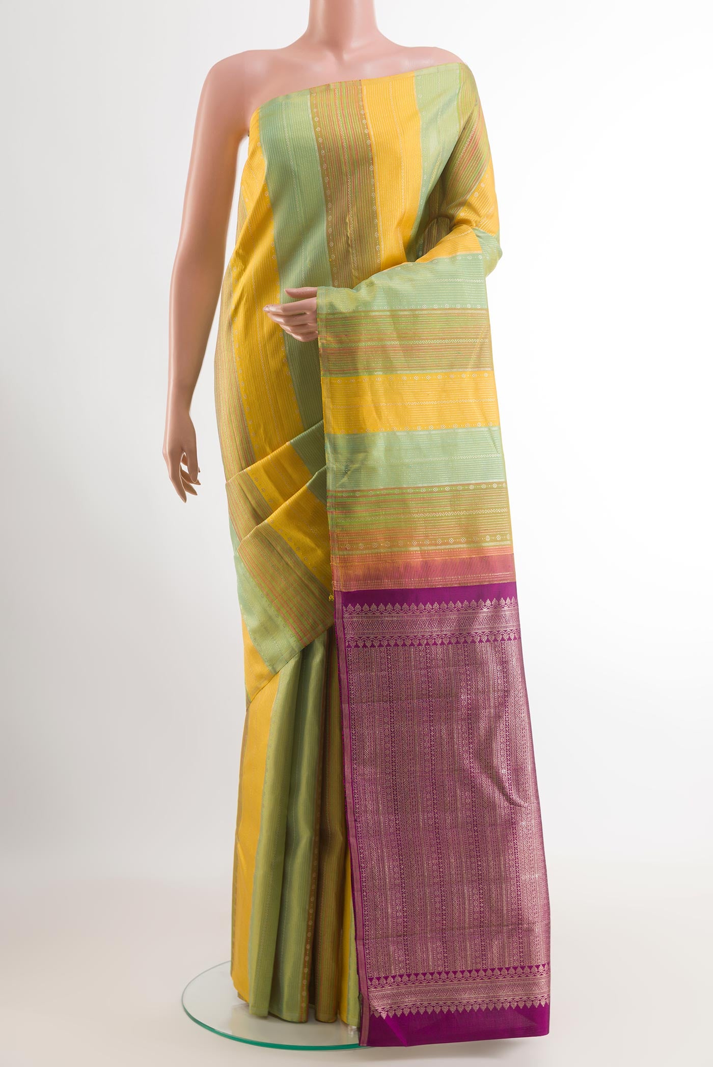 Yellow Kanjivaram Silk Saree with Stripes on the body and Zari Border.  displayed on a mannequin