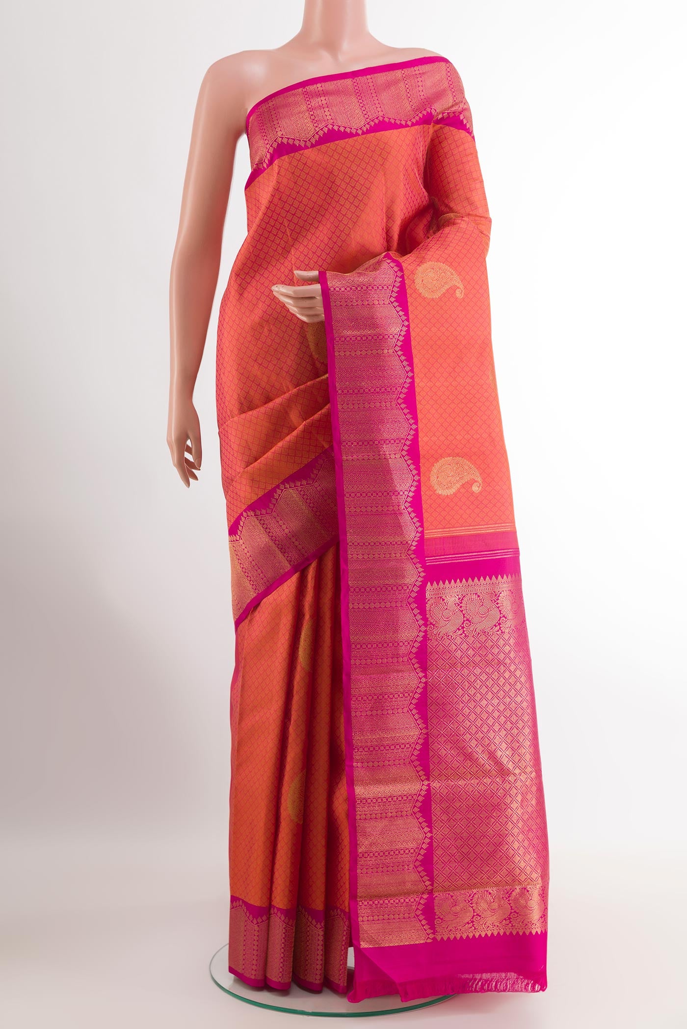 Peach Kanchipuram Silk Saree with Jacquard With Zari Butta on the body and Zari Border.  displayed on a mannequin