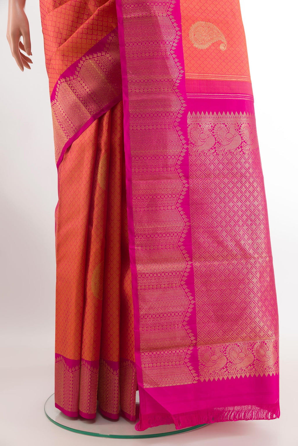 Pleats and pallu of Peach Kanchipuram Silk Saree with Jacquard With Zari Butta on the body and Zari Border. 