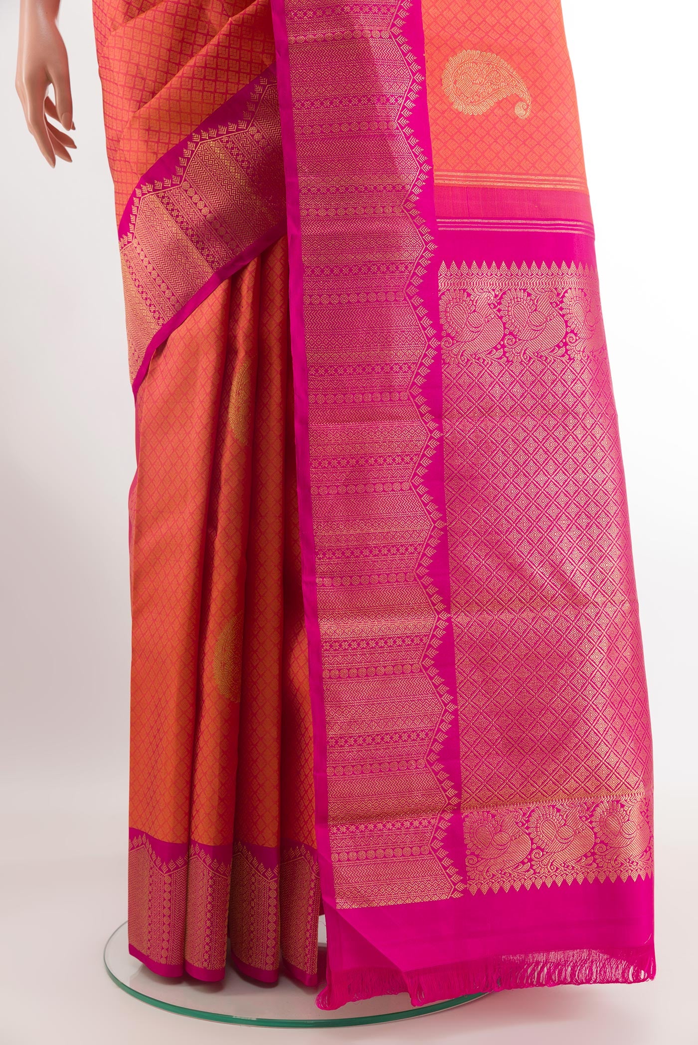 Pleats and pallu of Peach Kanchipuram Silk Saree with Jacquard With Zari Butta on the body and Zari Border. 