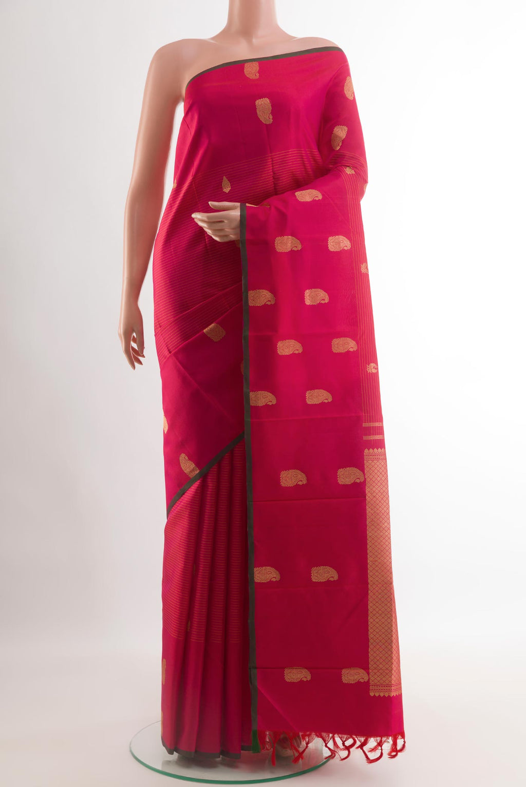 Pink Kanjivaram Silk Saree with Zari Butta on the body and Zari Border.  displayed on a mannequin