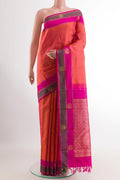 Peach Kanjivaram Silk Saree with Jacquard design on the body and Zari Border.  displayed on a mannequin