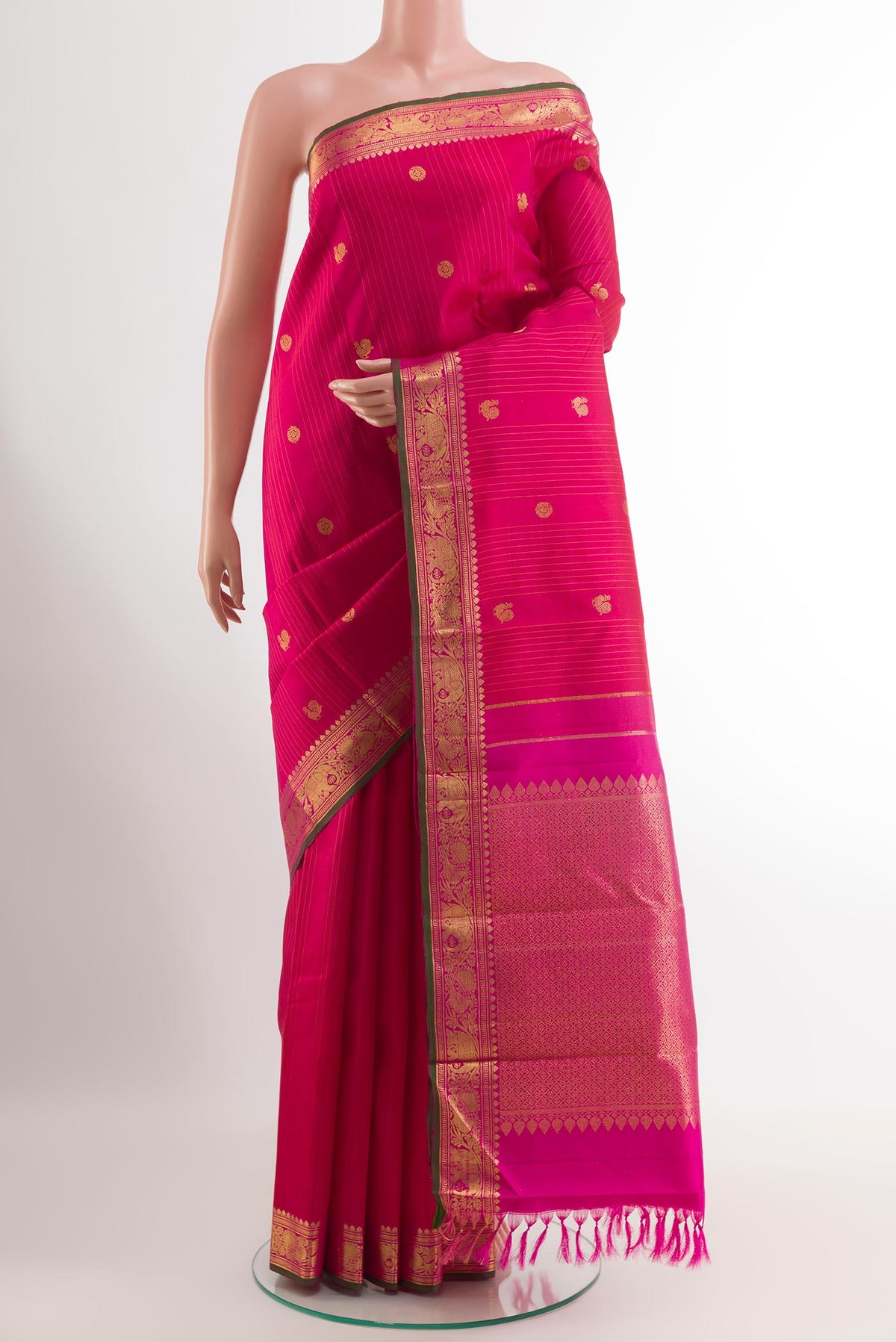 Pink Kanjivaram Silk Saree with Stripes on the body and Zari Border.  displayed on a mannequin