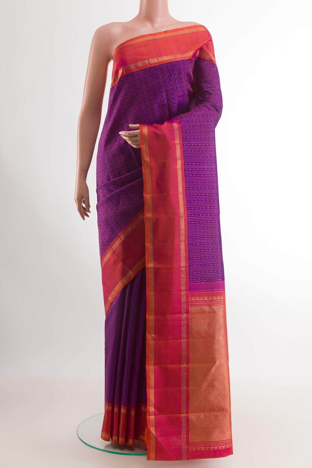 Purple Kanchipuram Silk Saree with Stripes on the body and Zari Border.  displayed on a mannequin